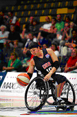 Stephanie Wheeler playing wheelchair basketball.