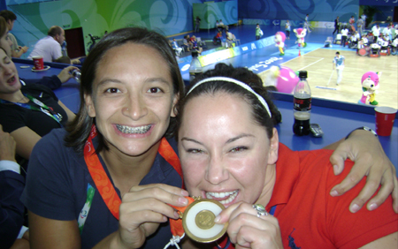 Patty Cisneros and Alana Nichols show off their basketball Gold Medals