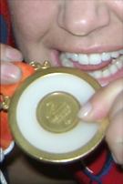 cisneros and nichols with gold medal